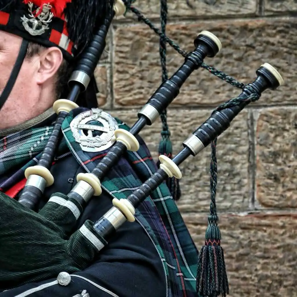Highland bagpiper playing the Great Highland bagpipe